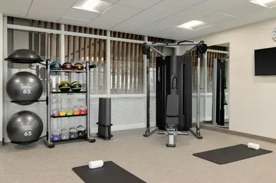 a room with a gym with weights and equipment at SpringHill Suites by Marriott Easton PA in Easton