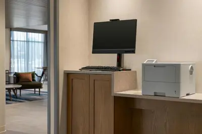 a desk with a computer monitor and a printer at Fairfield by Marriott Inn & Suites Bethlehem PA in Bethlehem