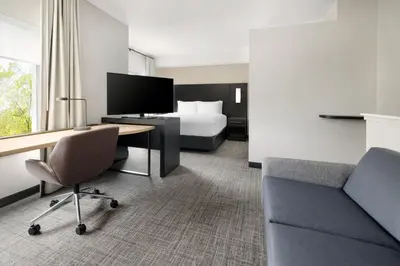a hotel room with a bed and a desk at Residence Inn by Marriott King of Prussia in King of Prussia