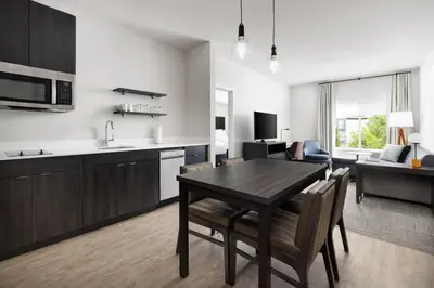 a kitchen and living room with a table and chairs at Residence Inn by Marriott King of Prussia in King of Prussia