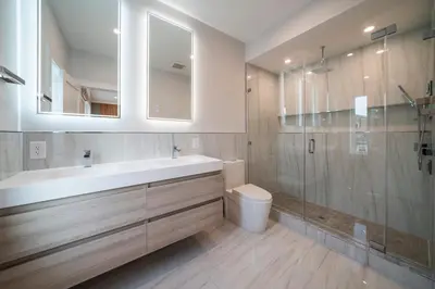 a bathroom with a sink and a toilet and a shower at Huge 2000 sqft Luxury & Stylish Condo minutes to New York in Jersey City