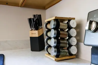 a stack of wine bottles in a wooden wine rack at The Cooper Home, Dogs Welcome! in Ephrata