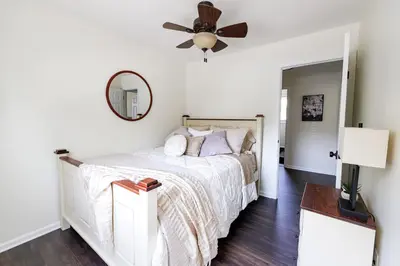 a white bedroom with a bed and a ceiling fan at The Cooper Home, Dogs Welcome! in Ephrata