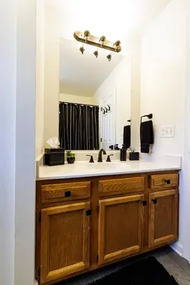 a bathroom with a sink and a mirror at The Cooper Home, Dogs Welcome! in Ephrata