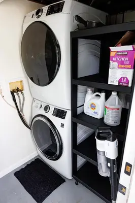 a washer and dryer sitting next to a shelf at The Cooper Home, Dogs Welcome! in Ephrata
