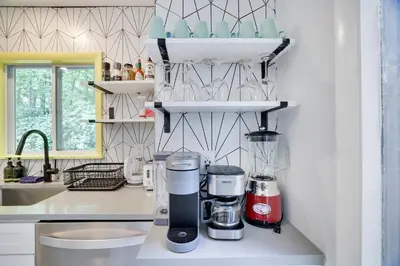 a kitchen with a coffee maker on a counter at Green Acres Nature Escape in Long Pond