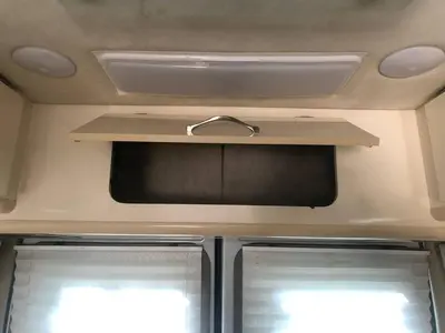 an interior view of an rv with two windows at Private and cozy RV, direct bus to NYC Manhattan only 2 blocks away, MetLife Stadium FIFA World Cup 25 minutes away in Linden