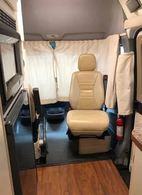 an interior view of an rv with a chair in it at Private and cozy RV, direct bus to NYC Manhattan only 2 blocks away, MetLife Stadium FIFA World Cup 25 minutes away in Linden