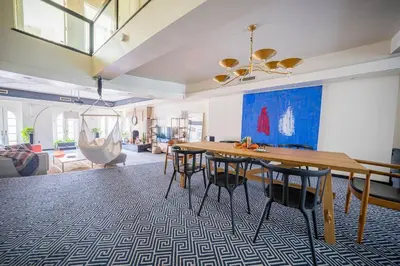 a living room with a wooden table and chairs at Private Gramercy TownHouse 3BR 3BA with Terrace in New York