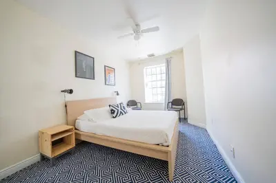 a bedroom with a bed and a desk and a window at Private Gramercy TownHouse 3BR 3BA with Terrace in New York