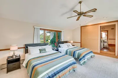 a bedroom with two beds and a ceiling fan at 5 Mi to Hersheypark Family Home with Game Room in Annville