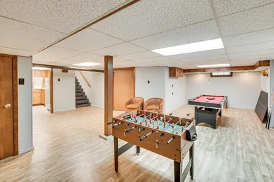 a room with a pool table and a ping pong ball at 5 Mi to Hersheypark Family Home with Game Room in Annville