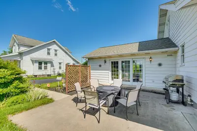 a patio with a table and chairs and a grill at 5 Mi to Hersheypark Family Home with Game Room in Annville