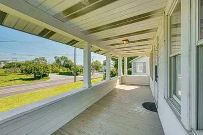an empty porch of a house with a view of the street at 5 Mi to Hersheypark Family Home with Game Room in Annville