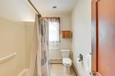 a bathroom with a toilet and a shower at 5 Mi to Hersheypark Family Home with Game Room in Annville