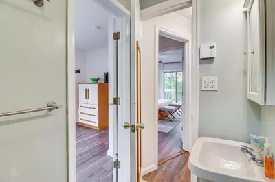 a bathroom with a sink and a mirror at Spacious Family Retreat Pocono Home with Deck in Albrightsville