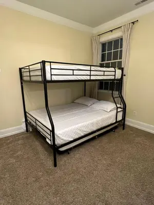 a bedroom with two bunk beds in a room at Beautiful River front home with private pool in Phillipsburg