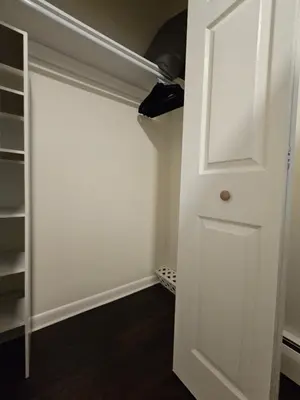 a closet with a white door and a shelf at Cozy & Modern 3-Bed Retreat - 8 Mins to Bridge St in Phoenixville