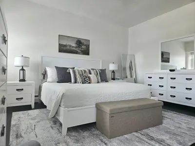 a white bedroom with a white bed and a dresser at Rustic & Renovated 3 Bed - 8 Min Walk to Bridge St in Phoenixville