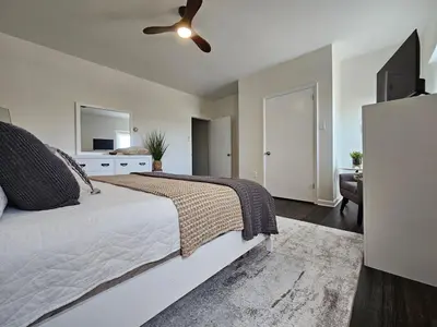 a bedroom with a bed and a ceiling fan at Rustic & Renovated 3 Bed - 8 Min Walk to Bridge St in Phoenixville