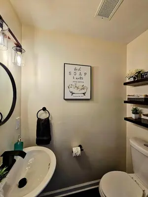 a bathroom with a white sink and a toilet at Rustic & Renovated 3 Bed - 8 Min Walk to Bridge St in Phoenixville