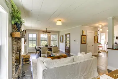 a living room with a couch and a table at Lovely Country Retreat, 4 Mi to Dtwn Narrowsburg! in Narrowsburg