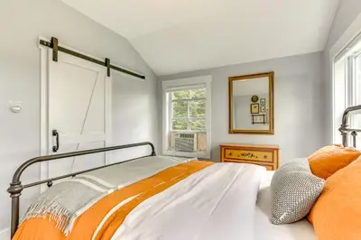 a bedroom with a bed and a window at Lovely Country Retreat, 4 Mi to Dtwn Narrowsburg! in Narrowsburg