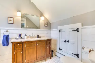 a bathroom with a sink and a mirror at Lovely Country Retreat, 4 Mi to Dtwn Narrowsburg! in Narrowsburg