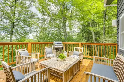 a wooden deck with a table and chairs and a grill at Lovely Country Retreat, 4 Mi to Dtwn Narrowsburg! in Narrowsburg