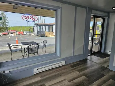 a room with a table and chairs and a window at Motel 81 in Dalton