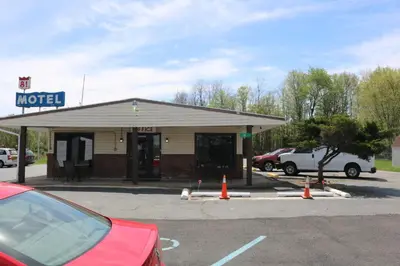 a gas station with cars parked in front of it at Motel 81 in Dalton