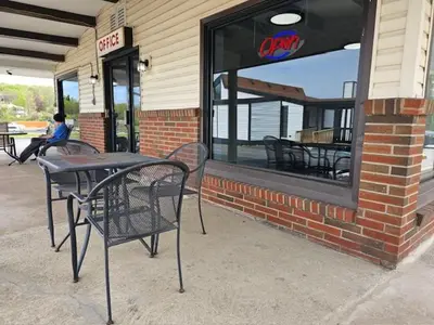 a table and chairs sitting outside of a restaurant at Motel 81 in Dalton