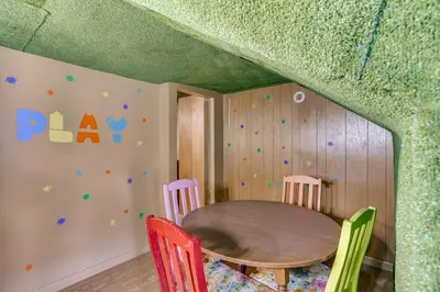 a play room with a table and chairs at Playroom and Fenced Yard Mt Carmel Family Home! in Mount Carmel