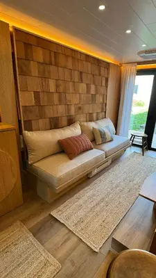 a couch in a living room in a house at City Hideaway, Off Grid Luxe in Lancaster