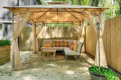 a gazebo with a couch and a table at Private Hot Tub Tree-Lined Poconos Home! in Pocono Summit