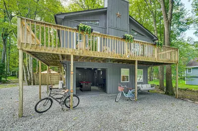 a house with two bikes parked in front of it at Private Hot Tub Tree-Lined Poconos Home! in Pocono Summit