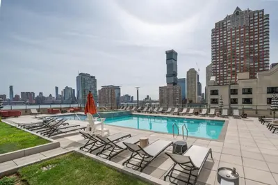 a swimming pool on the roof of a building at Global Luxury Suites Downtown Jersey City in Jersey City