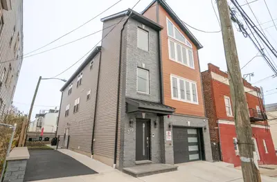 a building on the corner of a street at Divine Essence in Newark