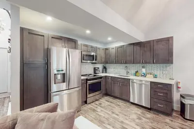 a kitchen with wooden cabinets and stainless steel appliances at The Best of Blakeslee in Blakeslee