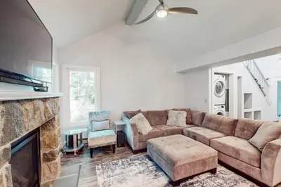 a living room with a couch and a fireplace at The Best of Blakeslee in Blakeslee