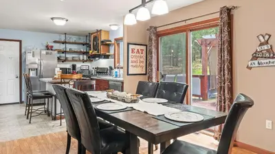 a kitchen and dining room with a table and chairs at The Great Escape by AvantStay Game Room in Albrightsville