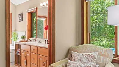 a bathroom with a sink and a mirror at The Great Escape by AvantStay Game Room in Albrightsville