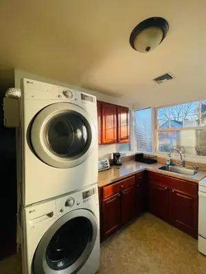 a kitchen with a washing machine and a sink at 3BR 1BA Near Train Station Monthly Deal in Elkins Park