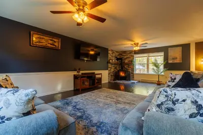 a living room with two couches and a ceiling fan at Mohawk-Kudil in Poconos ! Private Pool-Hot Tub-Lake Access-Game Room in Albrightsville