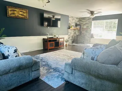a living room with two couches and a tv at Mohawk-Kudil in Poconos ! Private Pool-Hot Tub-Lake Access-Game Room in Albrightsville