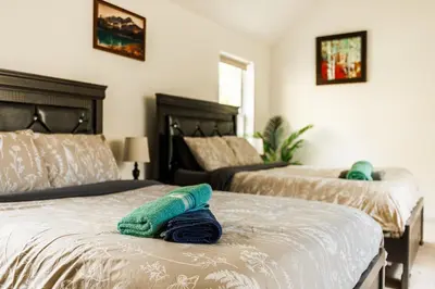a bedroom with two beds with towels on them at Mohawk-Kudil in Poconos ! Private Pool-Hot Tub-Lake Access-Game Room in Albrightsville