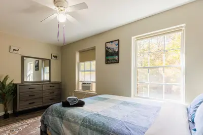 a bedroom with a bed and a ceiling fan at Mohawk-Kudil in Poconos ! Private Pool-Hot Tub-Lake Access-Game Room in Albrightsville