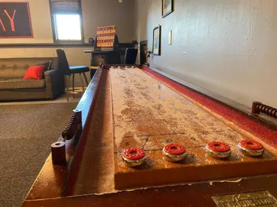 a ping pong table with four cupcakes on it at Big Blue Lake House complete with Game Room in Long Pond