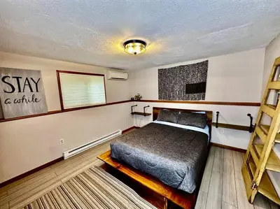 a bedroom with a bed in a room at Big Blue Lake House complete with Game Room in Long Pond