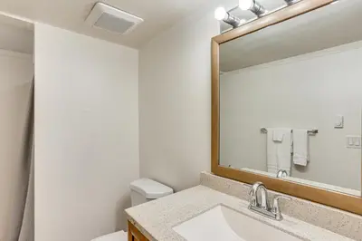 a bathroom with a sink and a mirror at 5 Mi to Downtown Harrisburg - Family Home! in Harrisburg